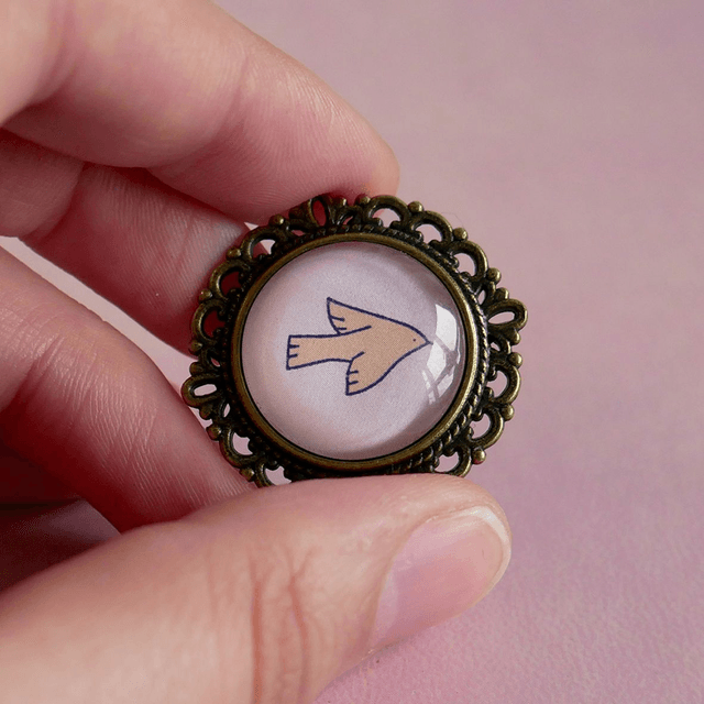 Broche ronde - Oiseau orange