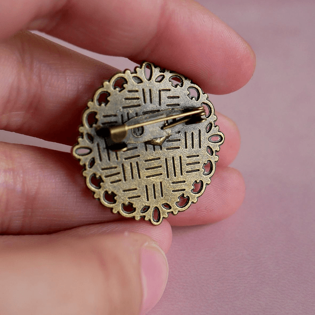 Broche ronde - Oiseau orange